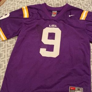 Woman’s medium but runs small. Nike LSU Jersey